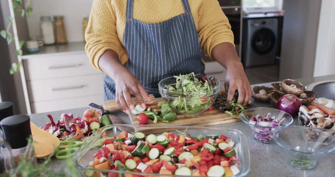 Person Preparing Healthy Salad and Fresh Vegetables in Modern Kitchen - Free Images, Stock Photos and Pictures on Pikwizard.com