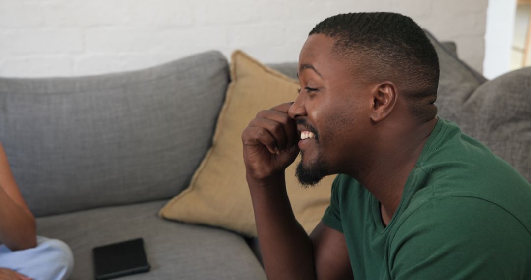 Man Pretending to Call, Relaxing on Sofa in Comfortable Living Room