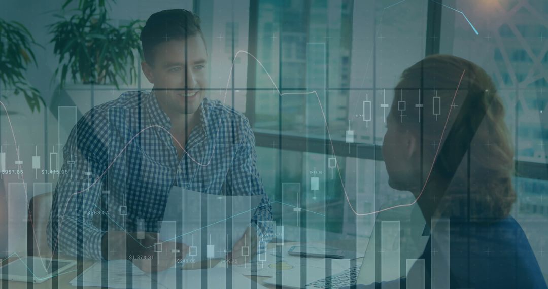 Business Professionals Discussing Charts in Modern Office Setting