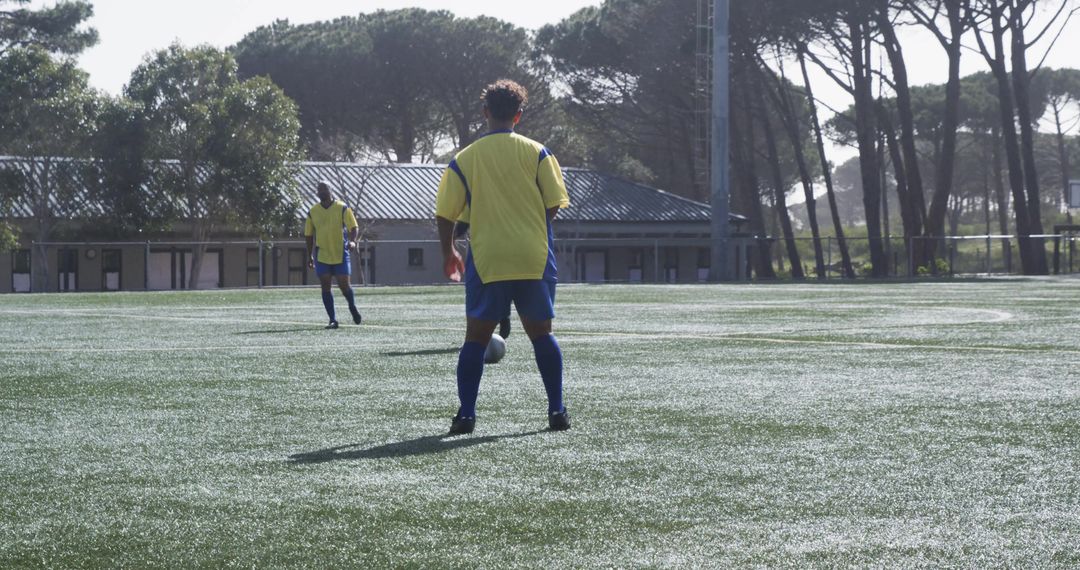 Youth Soccer Players Competing Intensely on Sunny Field