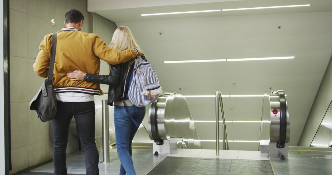 Couple Standing on Escalator at Modern Underground Metro Station - Free Images, Stock Photos and Pictures on Pikwizard.com