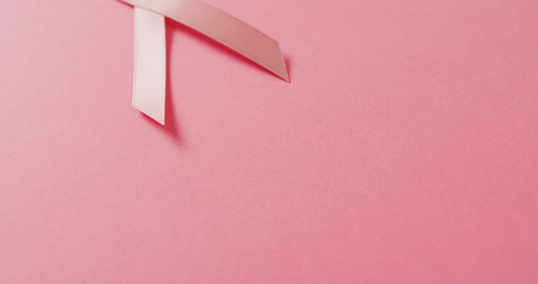 Image of pink breast cancer ribbon on pale pink background - Free Images, Stock Photos and Pictures on Pikwizard.com