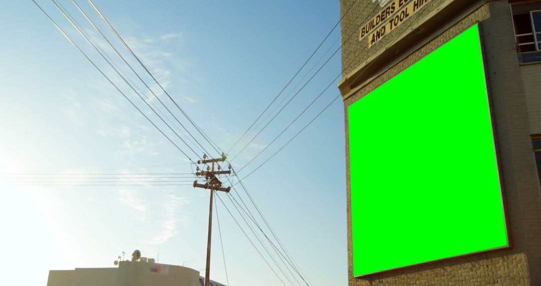 Green Screen on Building Exterior for Custom Advertising on Sunny Day - Free Images, Stock Photos and Pictures on Pikwizard.com