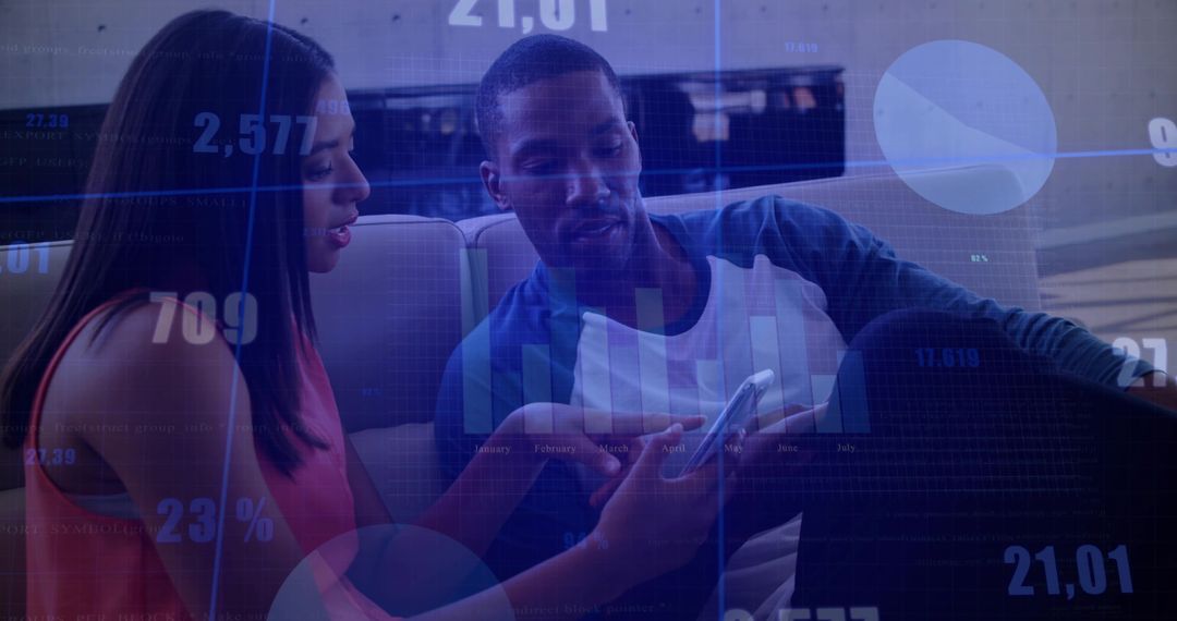 Coworkers Analyzing Data on Phone While Seated