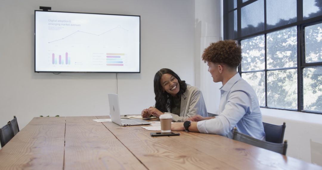 Diverse Business Team in Strategy Meeting with Data Presentation