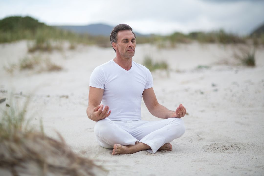 Mature man doing meditation - Free Images, Stock Photos and Pictures on Pikwizard.com