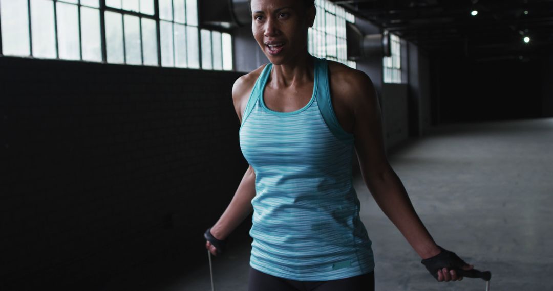 Athletic Woman Jumping Rope in Urban Gym - Free Images, Stock Photos and Pictures on Pikwizard.com