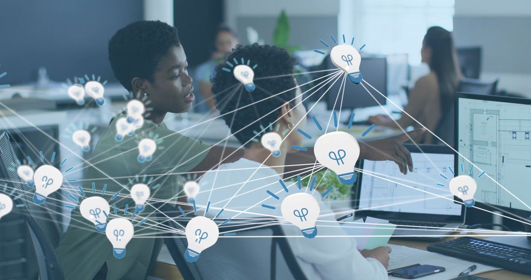 Collaborating African American Colleagues Discussing Innovative Ideas in Office