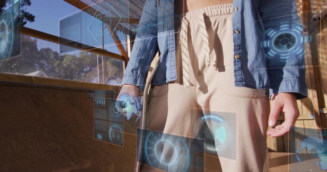 Adult holding skateboard and controller using augmented reality HUD on wooden skate ramp