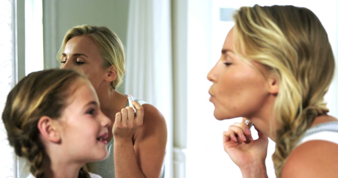 Mother and Daughter Applying Makeup in Mirror - Free Images, Stock Photos and Pictures on Pikwizard.com