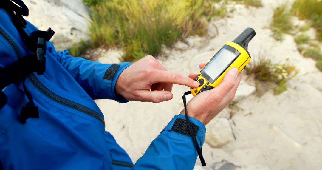 Hiker Navigating with GPS Device in Nature - Free Images, Stock Photos and Pictures on Pikwizard.com