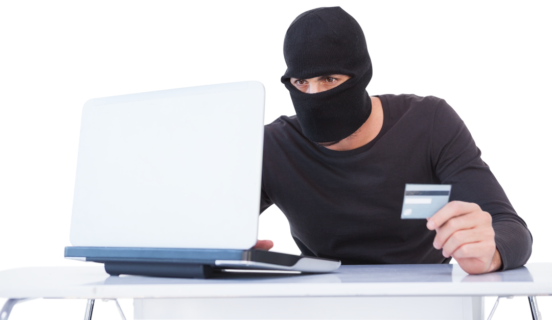 Burglar Wearing Ski Mask Using Laptop and Holding Credit Card - Fraud Context Transparent - Download Free Stock Images Pikwizard.com