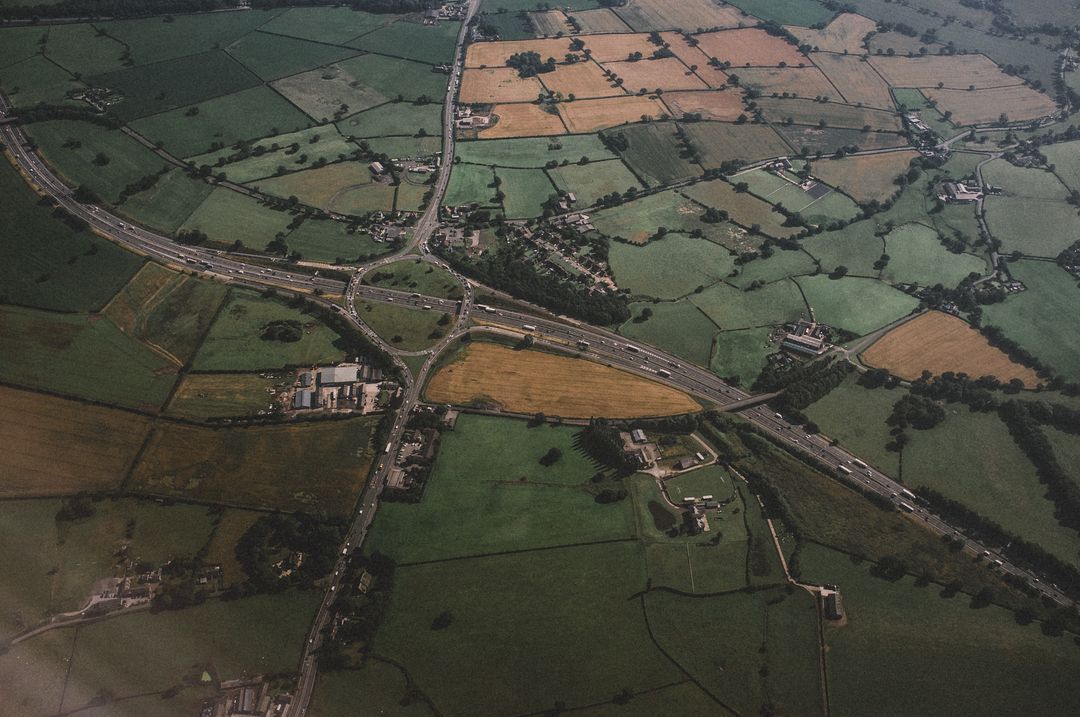 Aerial View of Agricultural Fields and Country Roads in Rural Landscape