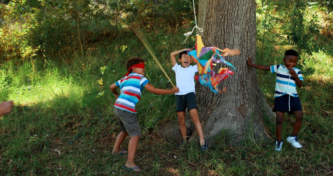 Children Playing Outdoors with Colorful Piñata - Free Images, Stock Photos and Pictures on Pikwizard.com