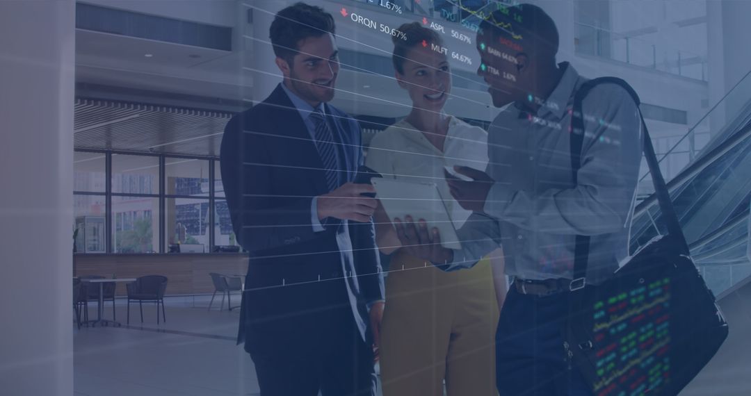 Diverse Business Team Reviewing Financial Data in Modern Office