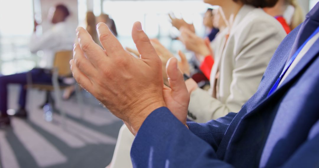 Business Seminar Attendees Applauding in Conference Setting