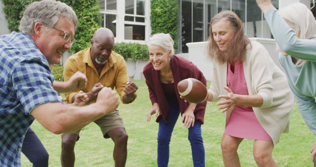 Senior Friends Playing American Football in Garden - Free Images, Stock Photos and Pictures on Pikwizard.com