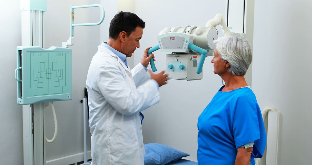 Doctor Examining Senior Female Patient During X-ray Procedure in Clinic - Free Images, Stock Photos and Pictures on Pikwizard.com