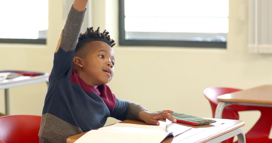 Eager Student in Classroom Raising Hand