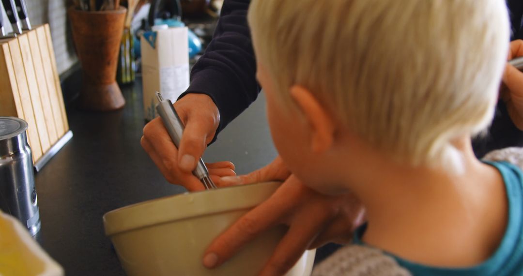 Father and Son Bonding Over Cooking at Home