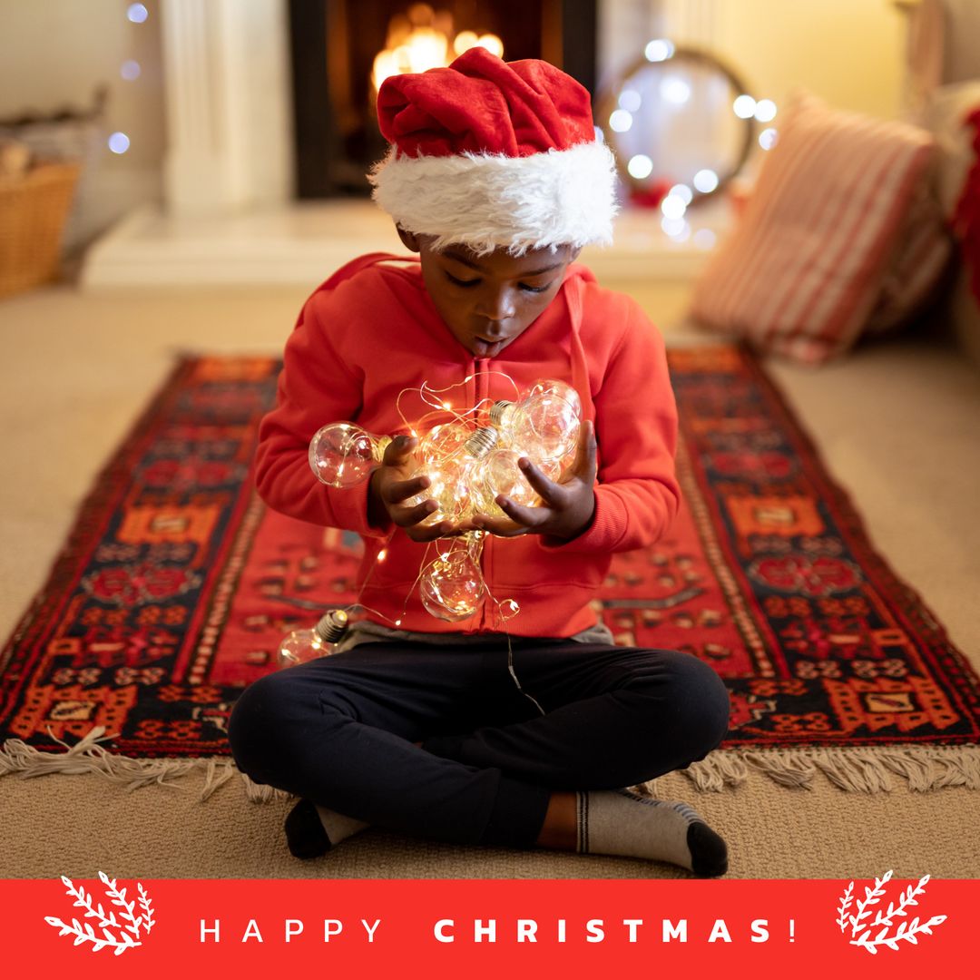 African American Boy Celebrating Christmas with Santa Hat and Lights - Download Free Stock Templates Pikwizard.com