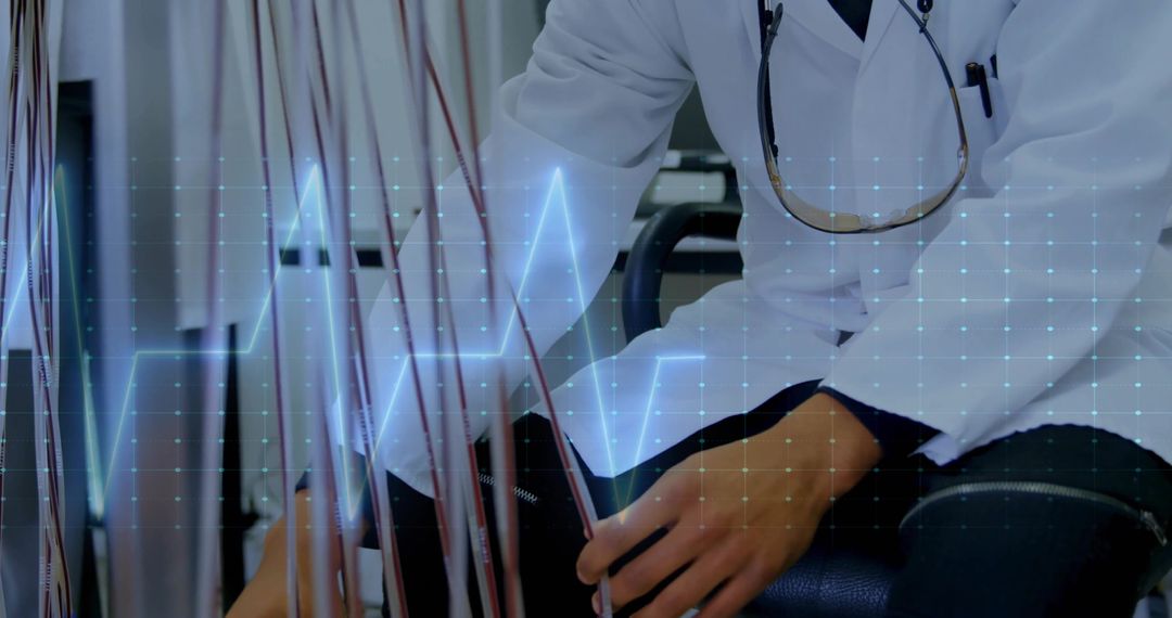 Laboratory Technician Working with Diagnostic Wiring and ECG Display