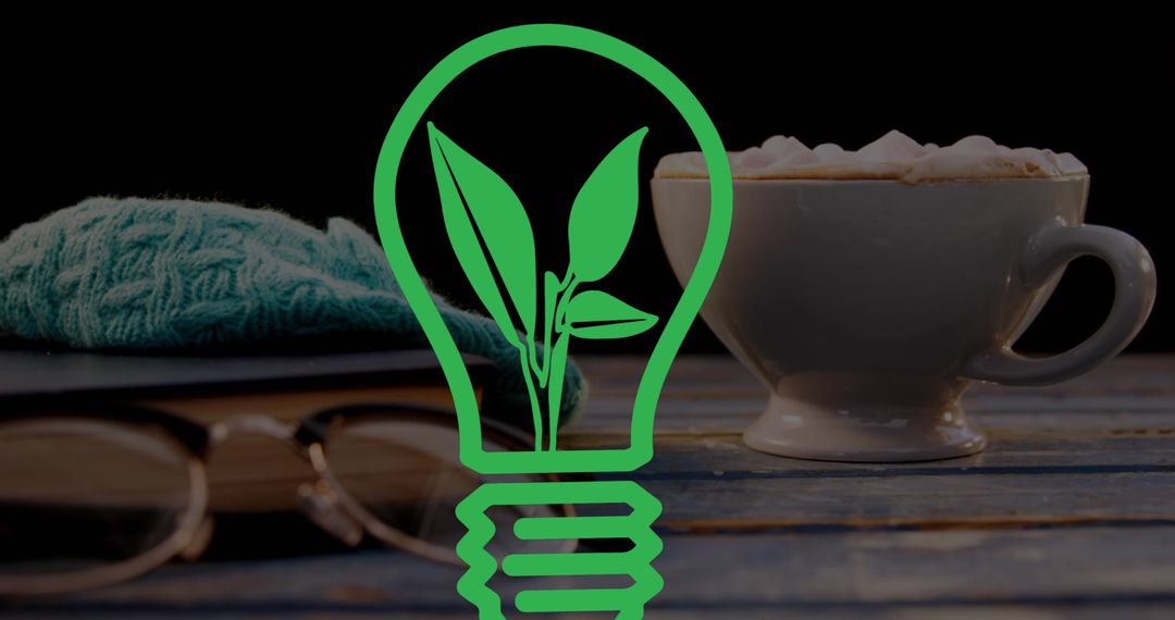 Green Energy Concept with Lightbulb and Coffee