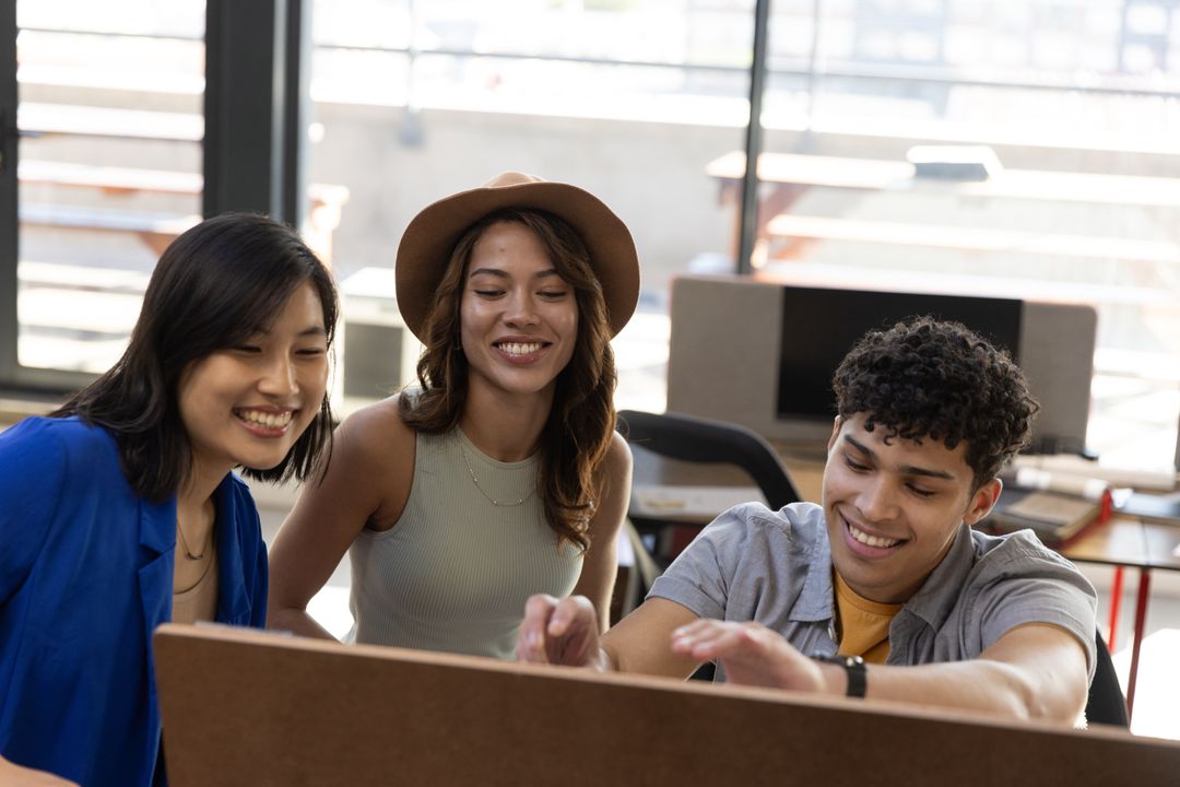 Diverse Team Sitting at Large Display Collaborating with Engagement