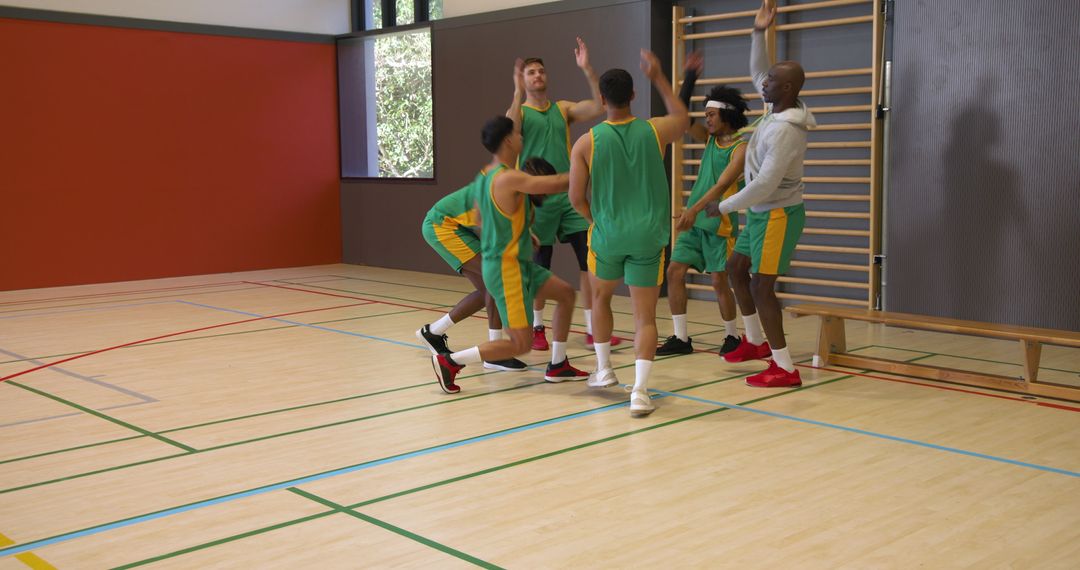 Diverse Basketball Team Celebrating Triumph During Gym Practice