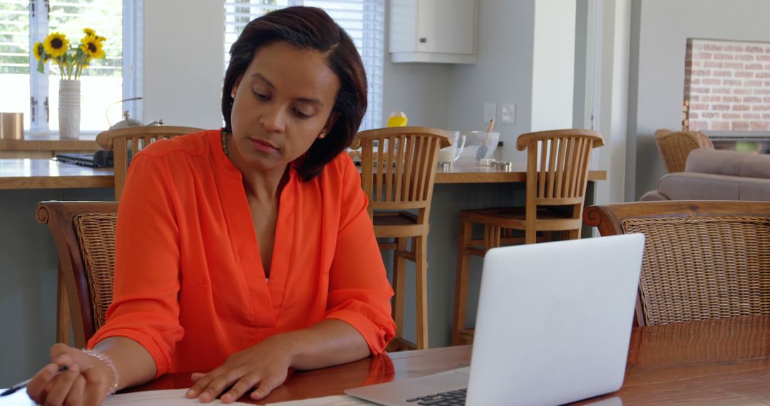 Focused African American Woman Working from Home on Laptop - Free Images, Stock Photos and Pictures on Pikwizard.com