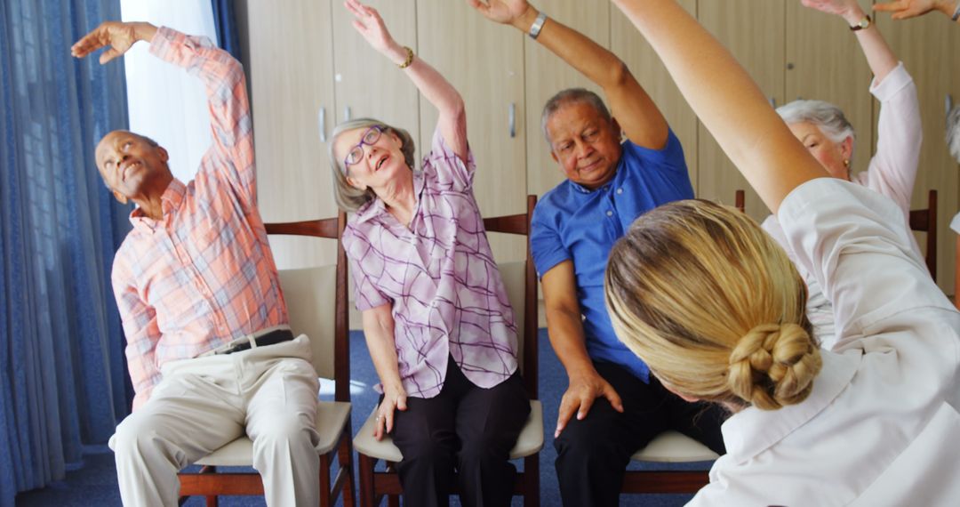 Seniors Engaging in Group Exercise Session for Health Wellness - Free Images, Stock Photos and Pictures on Pikwizard.com