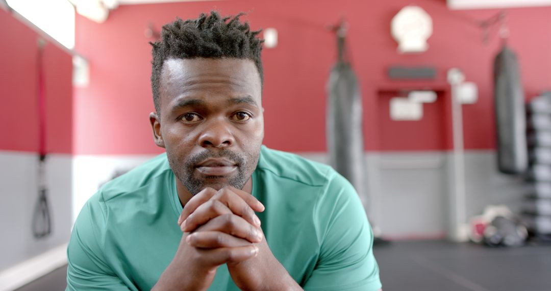 Focused African American Man Preparing for Workout in Gym