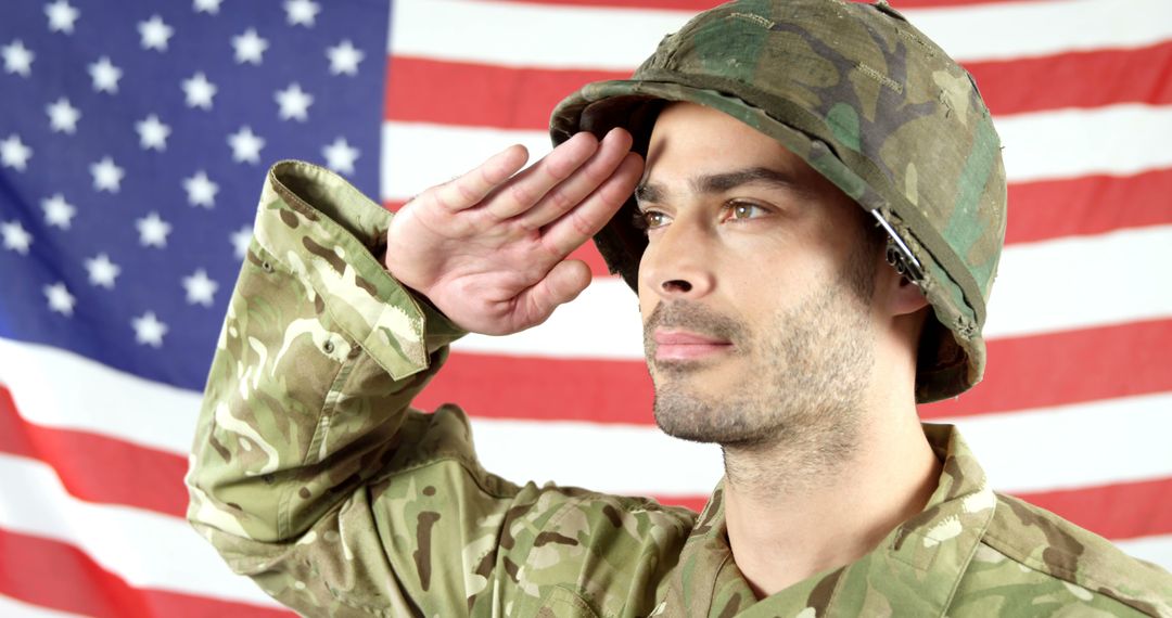 Proud Soldier Saluting Against American Flag - Free Images, Stock Photos and Pictures on Pikwizard.com