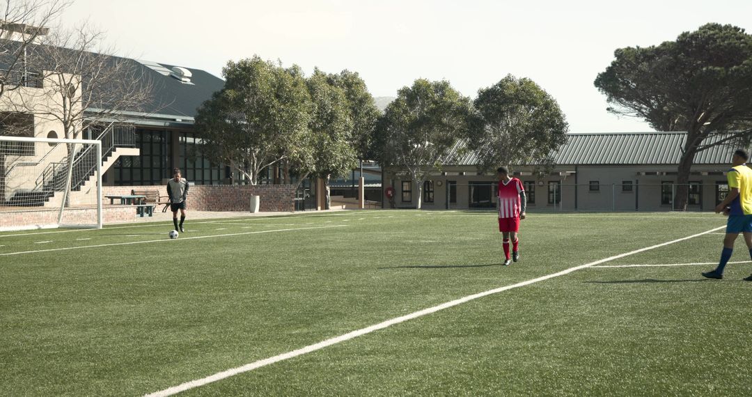 Soccer Players Walking on Field During Sunny Team Practice