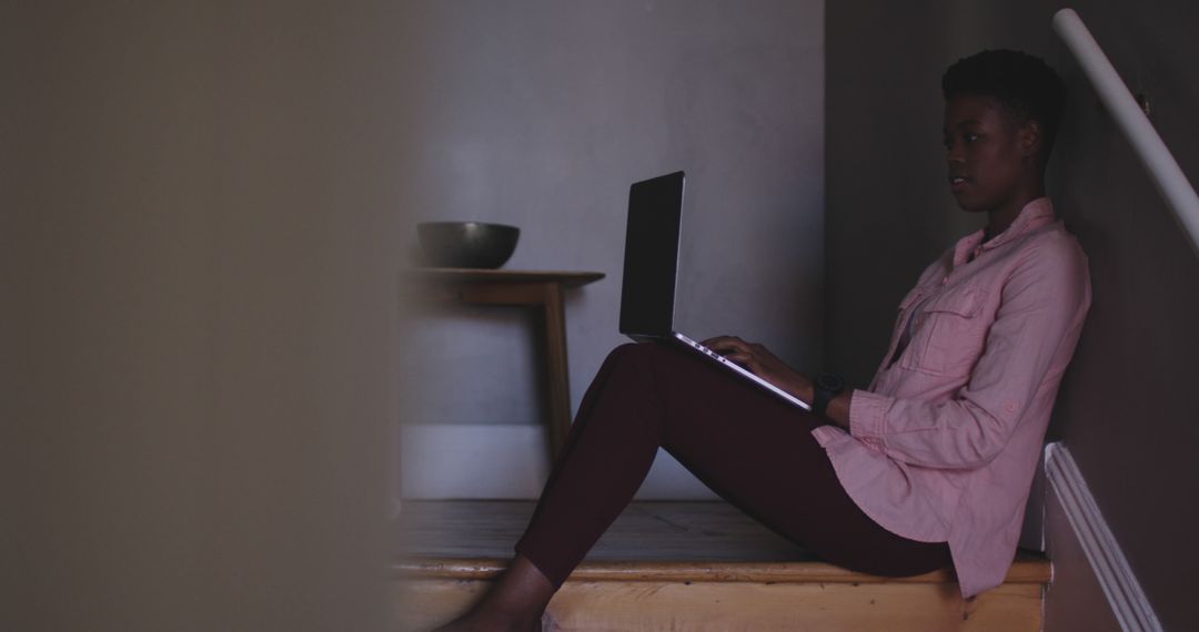 Woman Sitting on Floor at Home Using Laptop - Free Images, Stock Photos and Pictures on Pikwizard.com