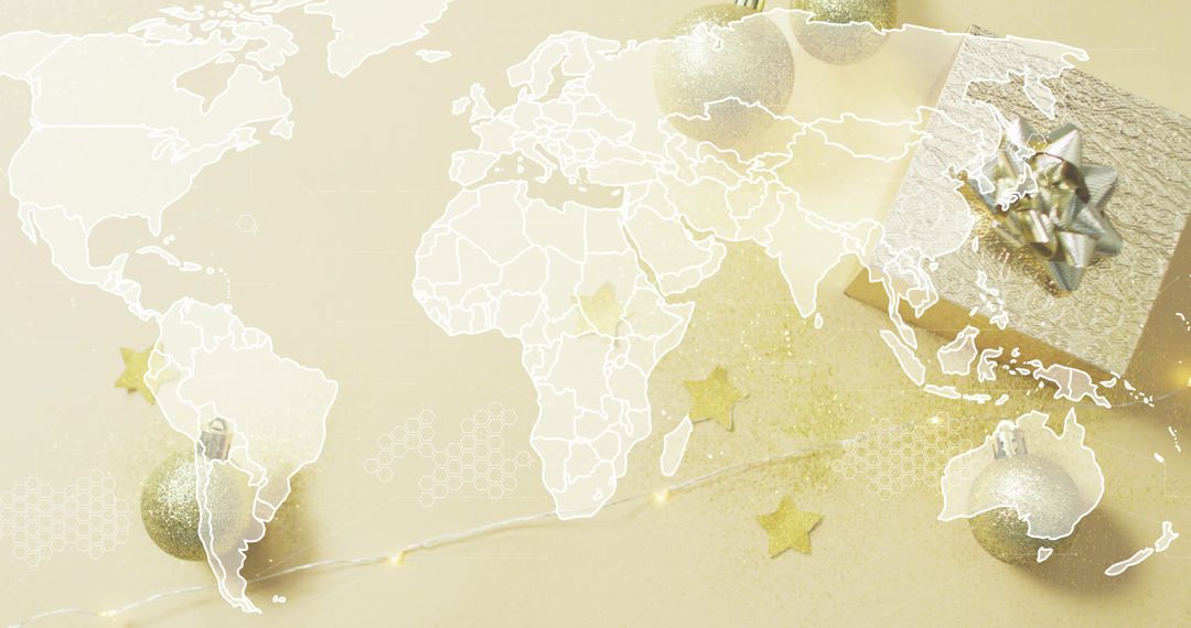 Gold holiday map flatlay featuring wrapped gift box, glitter ornaments, string lights