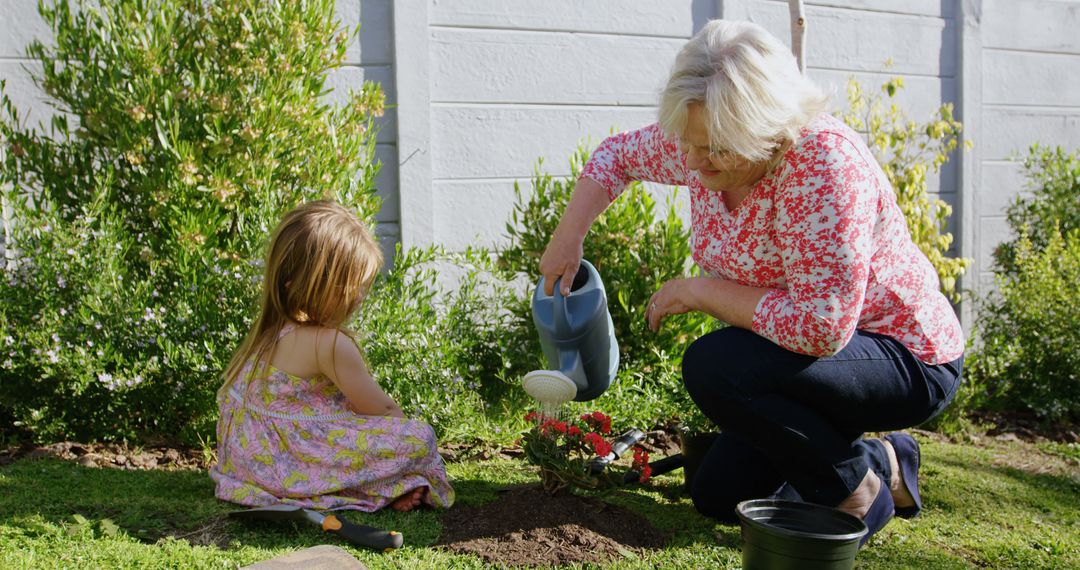 Grandmother and young girl bonding while gardening in backyard garden - Free Images, Stock Photos and Pictures on Pikwizard.com