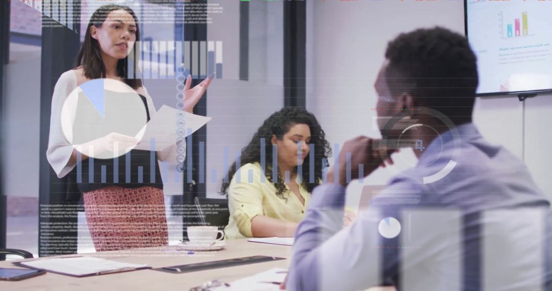 Diverse Team Discussing Report with Overlay of Graphs and Charts