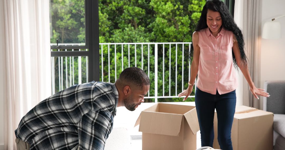 Couple Unpacking in New Home with Joy