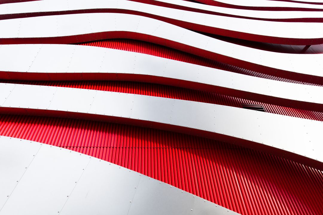 Modern Architectural Design with Red and White Wavy Patterns - Free Images, Stock Photos and Pictures on Pikwizard.com