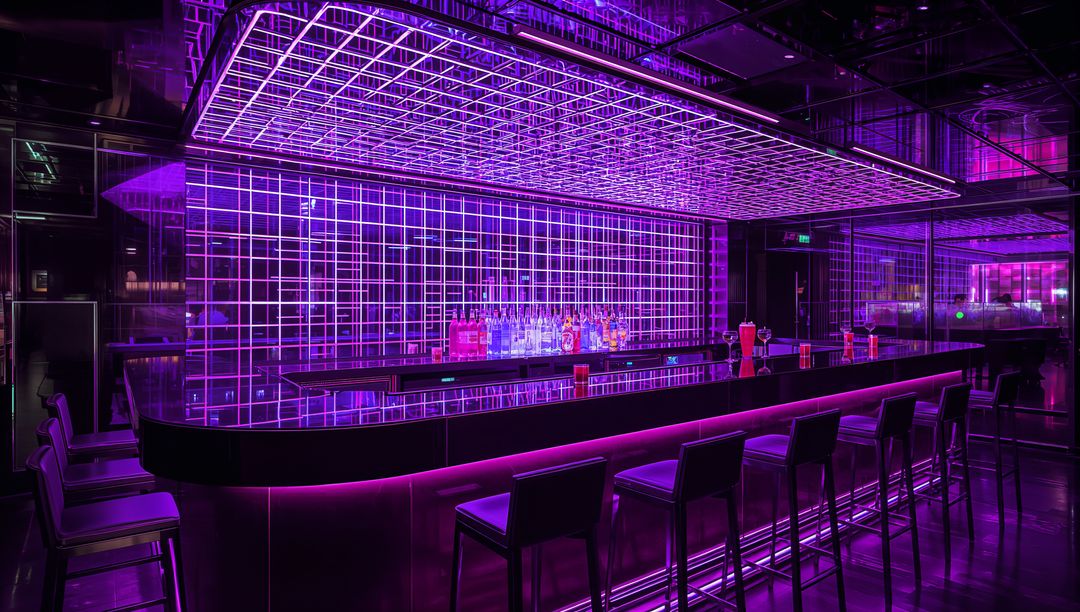 Neon-lit glossy bar counter with LED grid ceiling, mirrored shelves and bottle display