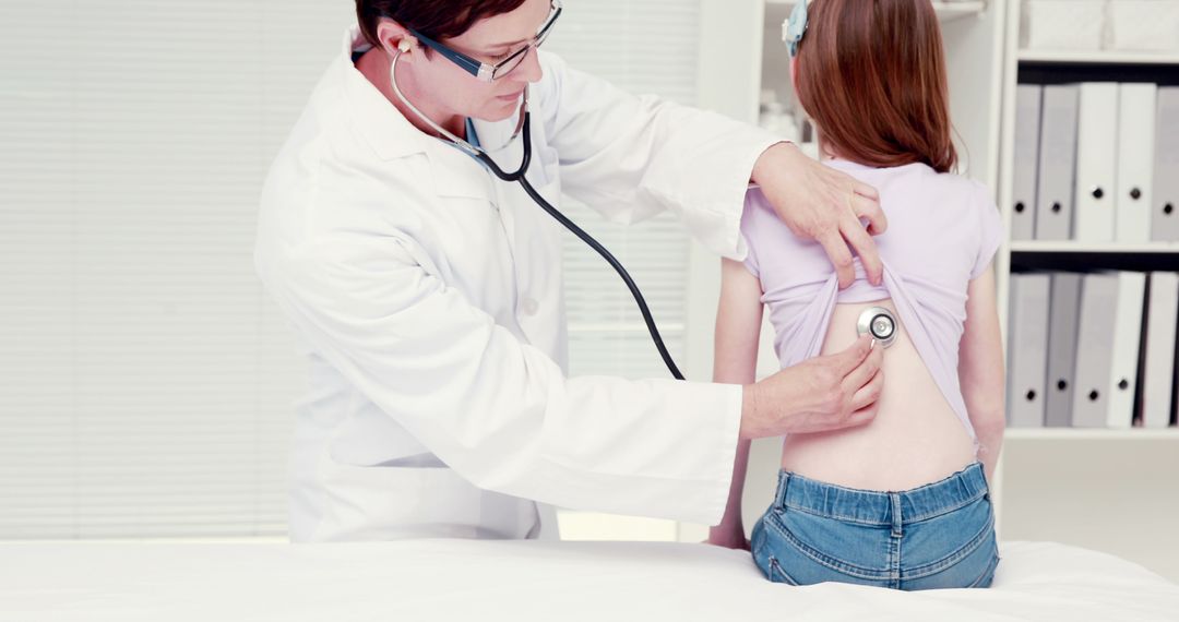 Doctor Examining Child Patient with Stethoscope in Medical Office - Free Images, Stock Photos and Pictures on Pikwizard.com