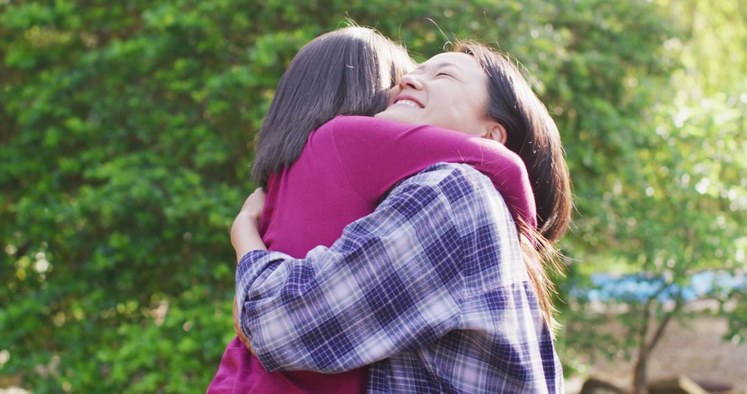 Happy Friends Hugging in Outdoor Park - Free Images, Stock Photos and Pictures on Pikwizard.com