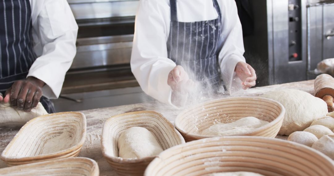 Bakers Kneading Dough in Artisan Bakery Kitchen - Free Images, Stock Photos and Pictures on Pikwizard.com