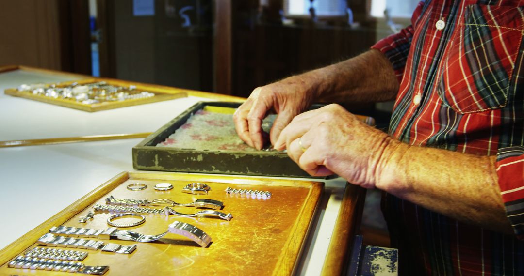 Skilled Horologist Repairing Silver Watches in Workshop - Free Images, Stock Photos and Pictures on Pikwizard.com