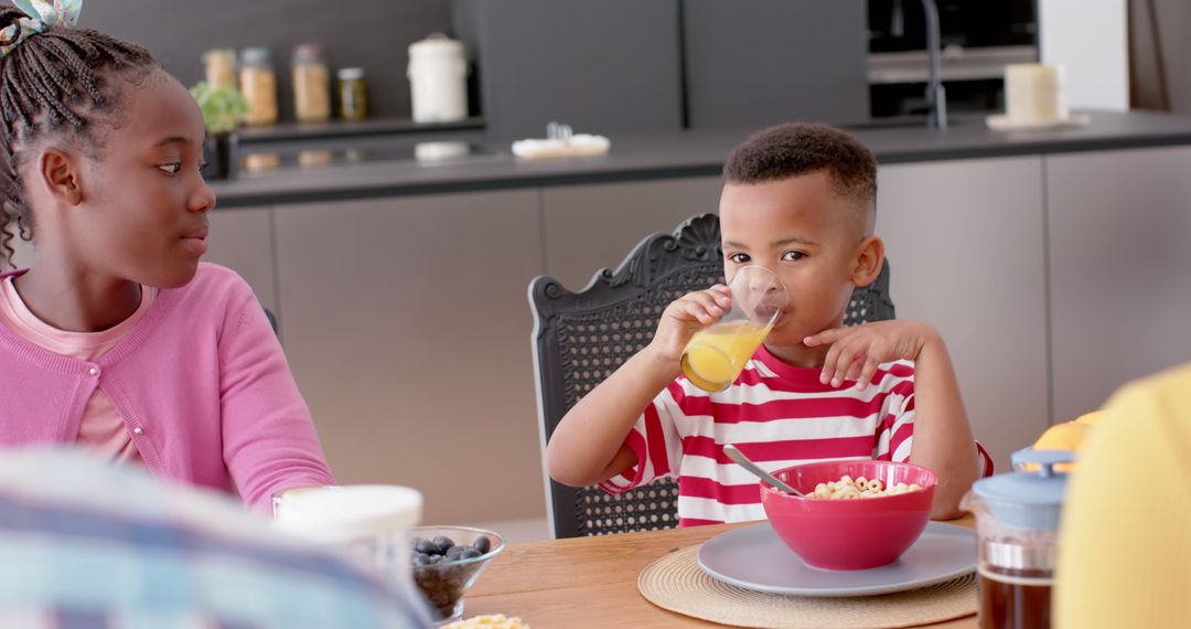 African American siblings having breakfast together - Free Images, Stock Photos and Pictures on Pikwizard.com