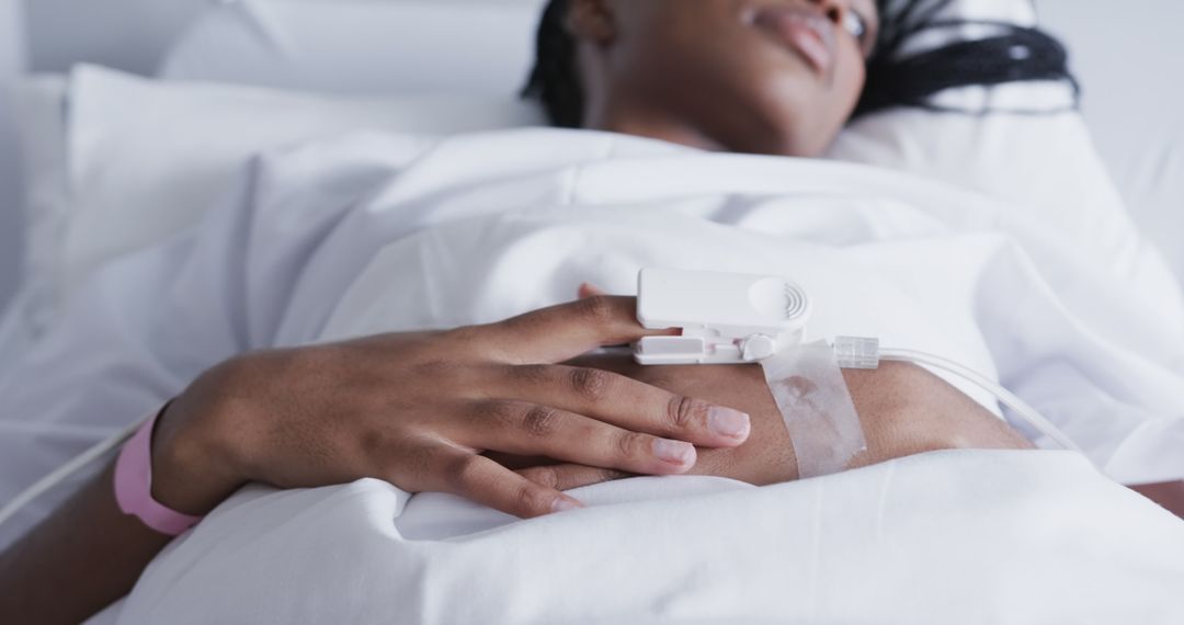 Woman Patient in Hospital Bed with Pulse Oximeter on Finger - Free Images, Stock Photos and Pictures on Pikwizard.com