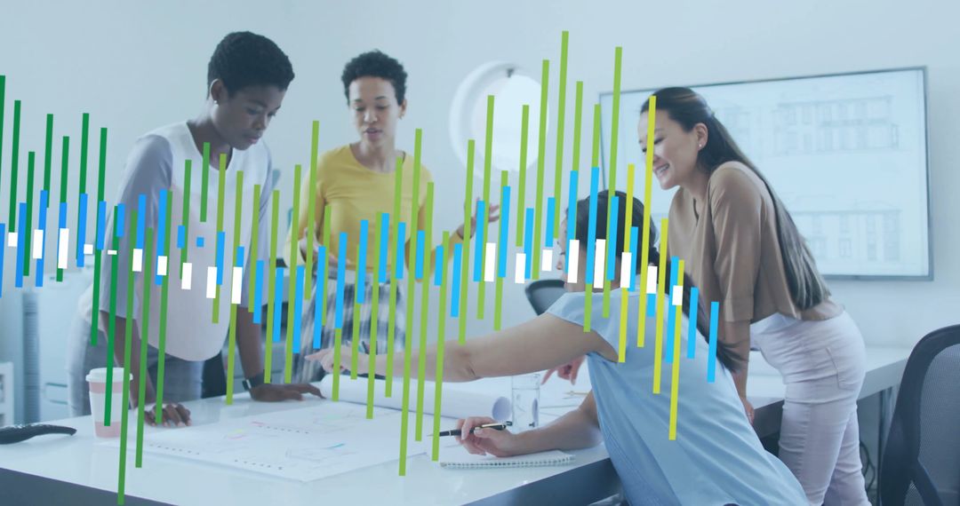 Diverse Team Collaborating on Data with Digital Interfaces