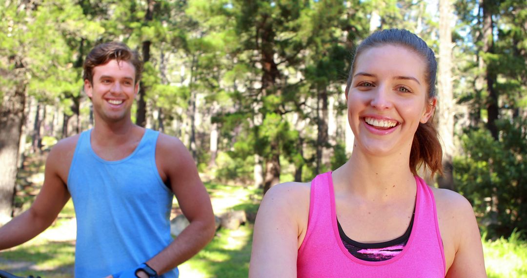 Young Couple Smiling During Outdoor Fitness Training in Forest - Free Images, Stock Photos and Pictures on Pikwizard.com