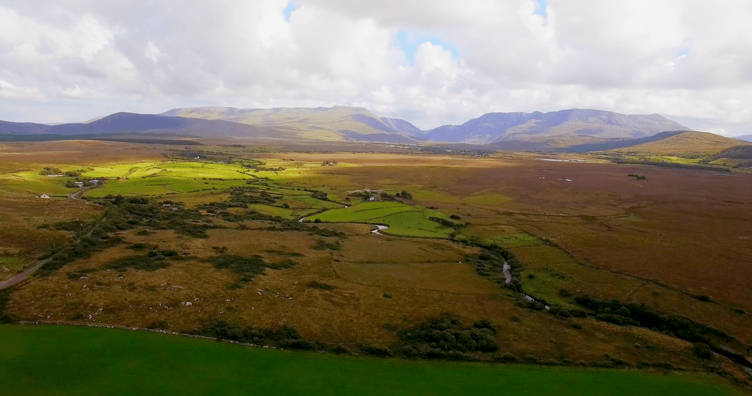 Beautiful Transparent Overview of Sprawling Fields Under Cloudy Sky